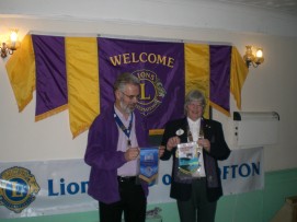 Lion President Harry exchanges Friendship Banners with DG Judith Goodchild