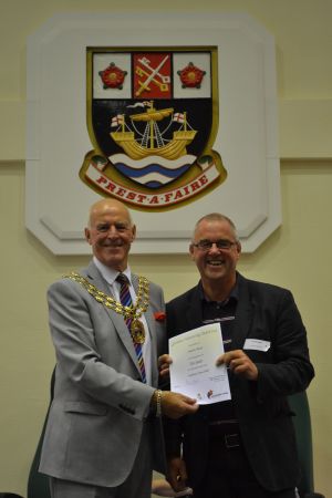 Charlie Read receiving his award from the Mayor